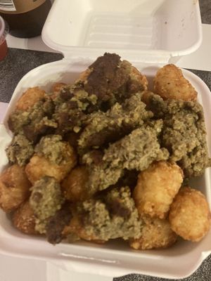 Tater tots smothered in breakfast sausage   at The BE-Hive in Nashville