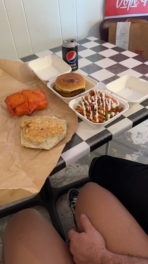Pizza crunch wrap, taco crunch wrap, Nashville chicken sandwich and nacho waffle fries.  at The BE-Hive in Nashville
