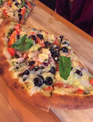 Freaky Greeky Pizza at Vegan Cave Tanoor Pizza in Vancouver