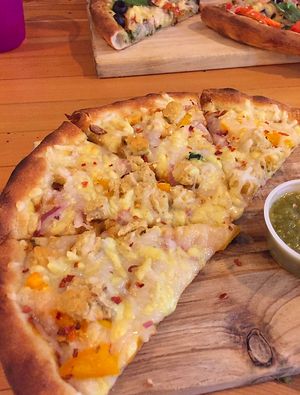 Bombay Badboy Pizza at Vegan Cave Tanoor Pizza in Vancouver