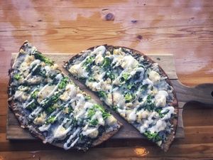 pesto prana pizza - broccoli, cashew ricotta three crusts to choose from, this was on the yam/cassava flour crust. i can’t wait to try the almond crust .. DELIGHTFUL at Vegan Cave Tanoor Pizza in Vancouver