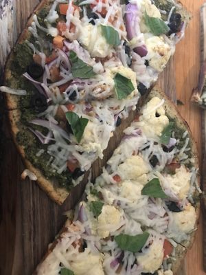 Freaky greeky with nut crust at Vegan Cave Tanoor Pizza in Vancouver
