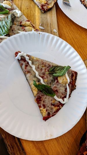 Buddha on the beach at Vegan Cave Tanoor Pizza in Vancouver