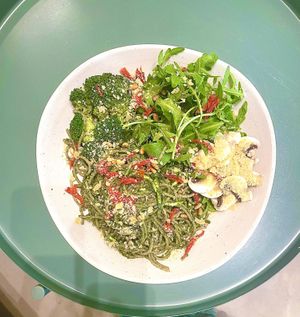 Bowl with pesto noodles. Arugula, and broccoli  at Bohl in Barcelona