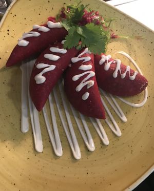 Beetroot empanadas with a spiced black bean and non dairy Parmesan filling salsa and cocofu  at Hispanic Mechanic in Frewville