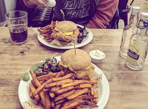chicken burger with sweet potato fries at Cafe Thrive in Bournemouth