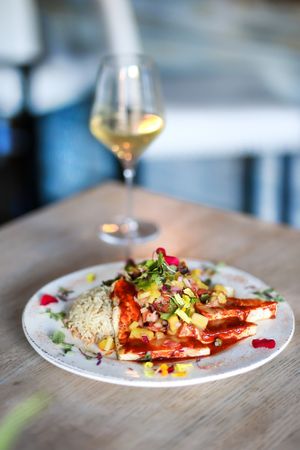 Pastor Tofu Filet - grilled organic tofu marinated in Pastor rub, topped with jalapeno pineapple reduction, served with  grilled asparagus, broccoli, cauliflower and white rice at Patron's Corner in San Diego