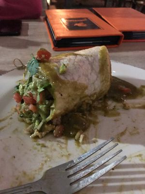 Half of the burrito to go at Patron's Corner in San Diego