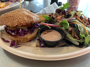 Jack’s fried chicken sandwich (V) and side salad  at Golden Road Brewing - DTLA in Los Angeles
