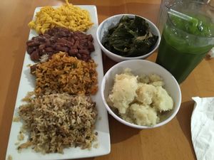 Soul food platter plus daily greens, mashed potatoes, and juice at Vegan Friendly Foods in Baton Rouge