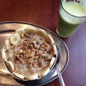 vegan oatmeal with walnuts and banana and a fresh pressed green juice at Green Sage Cafe - Broadway in Asheville