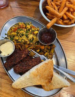 Woodstock breakfast plate with a side of sweet potato fries. Loved that tempeh bacon!   at Green Sage Cafe - Broadway in Asheville