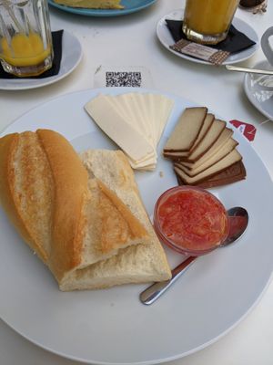 Breakfast: tostada w/ cheese, tofu & tomato spread. at Cafe Madrigal in Valencia