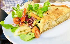 Mouthwatering onion quiche! 😋  at Cafe Madrigal in Valencia