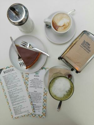 Coffee with plant based milk, matcha latte and chocolate cake (gluten free) at Cafe Madrigal in Valencia
