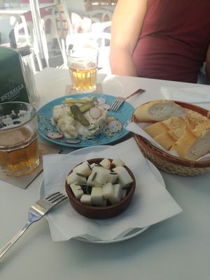 Queso marinado and ensaladilha alemana at Cafe Madrigal in Valencia