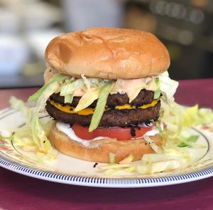 BIG BAM BURGER - Two Beyond patty’s w/Cheese, lettuce, tomatoes, onions, pickles,  mayo and tickle sauce.  at Hang Space in Richmond