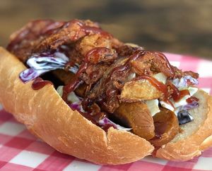 Occasional specials - BBQ Frankfurter with homemade crispy onions, slaw and bbq sauce. Delish!  at Hang Space in Richmond