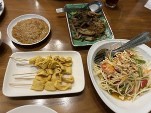Satay, Somtum and vegetarian duck stir fried with herbs  at L'Orangerie in Bangkok