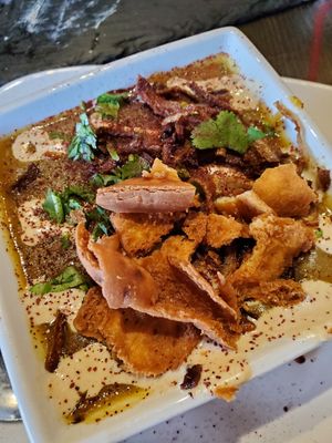 The lentil soup topped with Tahiti, pita chips, and crispy onions at Falafel Shack in Chambersburg