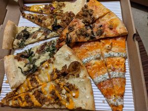 Reuben, Philly Cheese steak, Buffalo, Sausage & Mushroom, Old School, Screamer slices at Screamer's Pizzeria - Crown Heights in Brooklyn