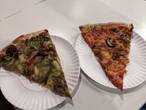 Artichoke and Sausage & Mushroom pizza slices at Screamer's Pizzeria - Crown Heights in Brooklyn