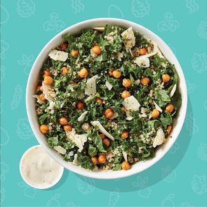 KALE CAESAR: 
Kale, Quinoa, Crispy Chickpeas, Parmesan Cheese, Hemp Seeds, Lime Wedge, Greek Yogurt Caesar Dressing at freshii - Mahogany  in Calgary