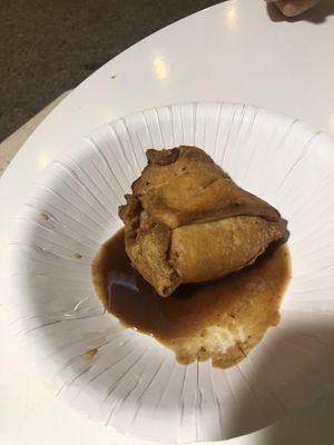 Samosa with one bite out of it. Delicious    at Satwik in Port Macquarie