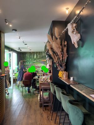 Seating inside with cow skull on the wall at Gartensalon in Munich