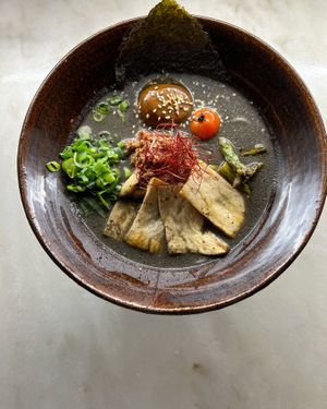 KUROGOMA RAMEN vegetarian broth with black sesame sauce, homemade seitan, eryingi mushrooms at Koppu Ramen Izakaya in Lisbon