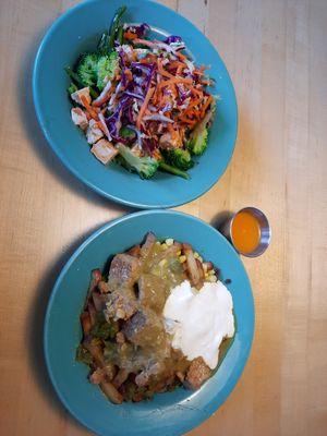 Top: Thai bowl w/ tofu & brown rice. Bottom: house-roasted green chilis, potatoes, tempeh, sub vegan sour cream & cheese. Habanero salsa at Laughing Planet in Vancouver