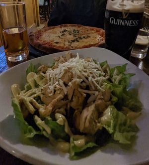 Vegan chicken Caesar and vegan cheese pizza at La Caverna in Dublin