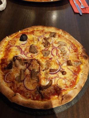 Vegan margherita with extra toppings (wild mushrooms and onions) at La Caverna in Dublin