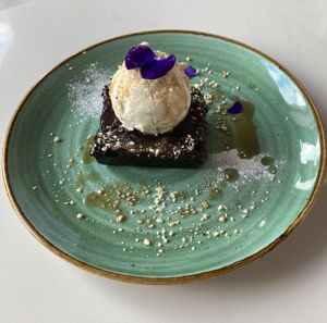 Chocolate brownies, vanilla ice cream and salted caramel sauce  at Twelve Eatery in Bournemouth