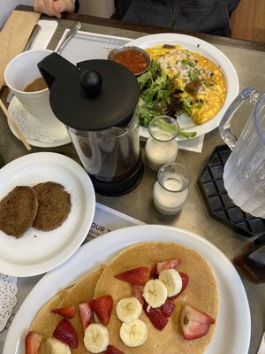 Just Egg omelet with beyond sausage, black beans, cilantro, avocado & onions. Vegan pancakes with fruit and a side of beyond sausage. French press coffee. It was all sooooo good!!  at Turning Point in Lawrence Township