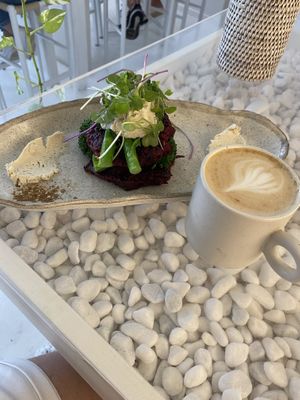 Beetroot zucchini fritters and soy lattees  at The Milkman's Daughter in Mermaid Beach
