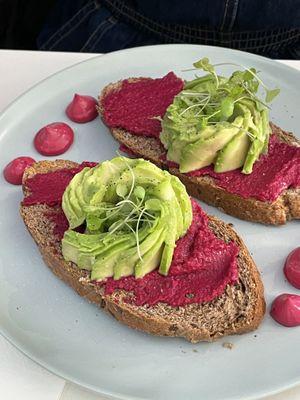 Avocado with beetroot Hummus on toast.  at Naked Bakery in Edinburgh