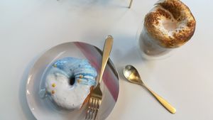 Doughnut and vegan white hot chocolate  at Naked Bakery in Edinburgh