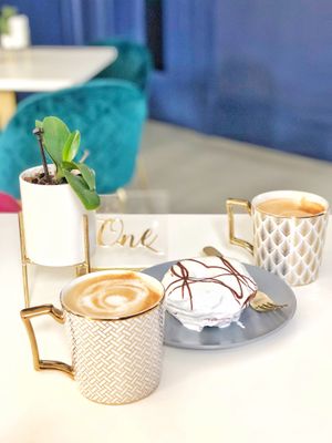 Oat lattes and red velvet donut at Naked Bakery in Edinburgh