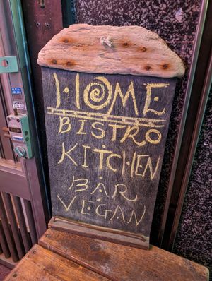 Sign on street level at HOME Bistro and Cafe in Busan