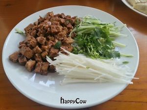 This fun dish came with small wraps to make small food bundles. at Beijing Vegan Hut in Beijing
