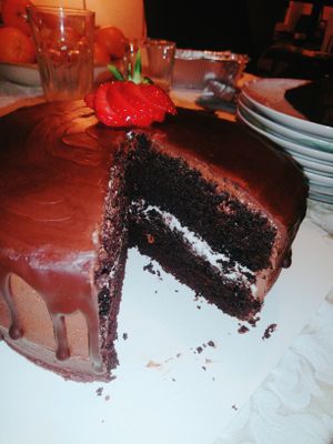 Double Layer Chocolate Cake with a Hazelnut Cream Centre and a Ganache Drip at Sweets by Pepper in Geneva