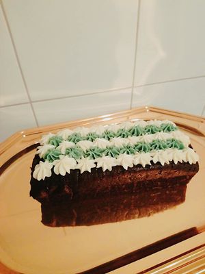 Chocolate holiday loaf with vegan cream cheese icing at Sweets by Pepper in Geneva