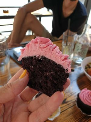 Moist mouthwatering chocolate cupcake with raspberry frosting at Sweets by Pepper in Geneva