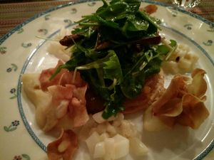 Endive and orange pie with parsnip on the side and leafy salad at Le Relais de Chambésy in Geneva