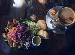 salad and almond milk latte  at Kafe in Ubud