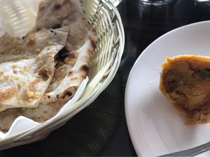 Garlic naan and vegetable samosa (vegan) at Radha's in Te Anau