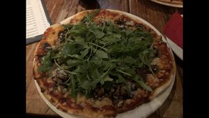 ‘Mount Victoria 1064m’ - Macadamia pesto base, pine nuts, sautéed field mushrooms topped with rocket and vegan cheese   at Station Bar & Woodfired Pizza in Katoomba