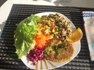 Lunch with beans, vegan burger, mashed squash, and salad at Cantinho da Regina in Sesimbra