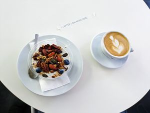 Vegan oatmeal and cappuccino with oatmilk at The Visit Coffee Roastery at The Visit Coffee Roastery in Berlin